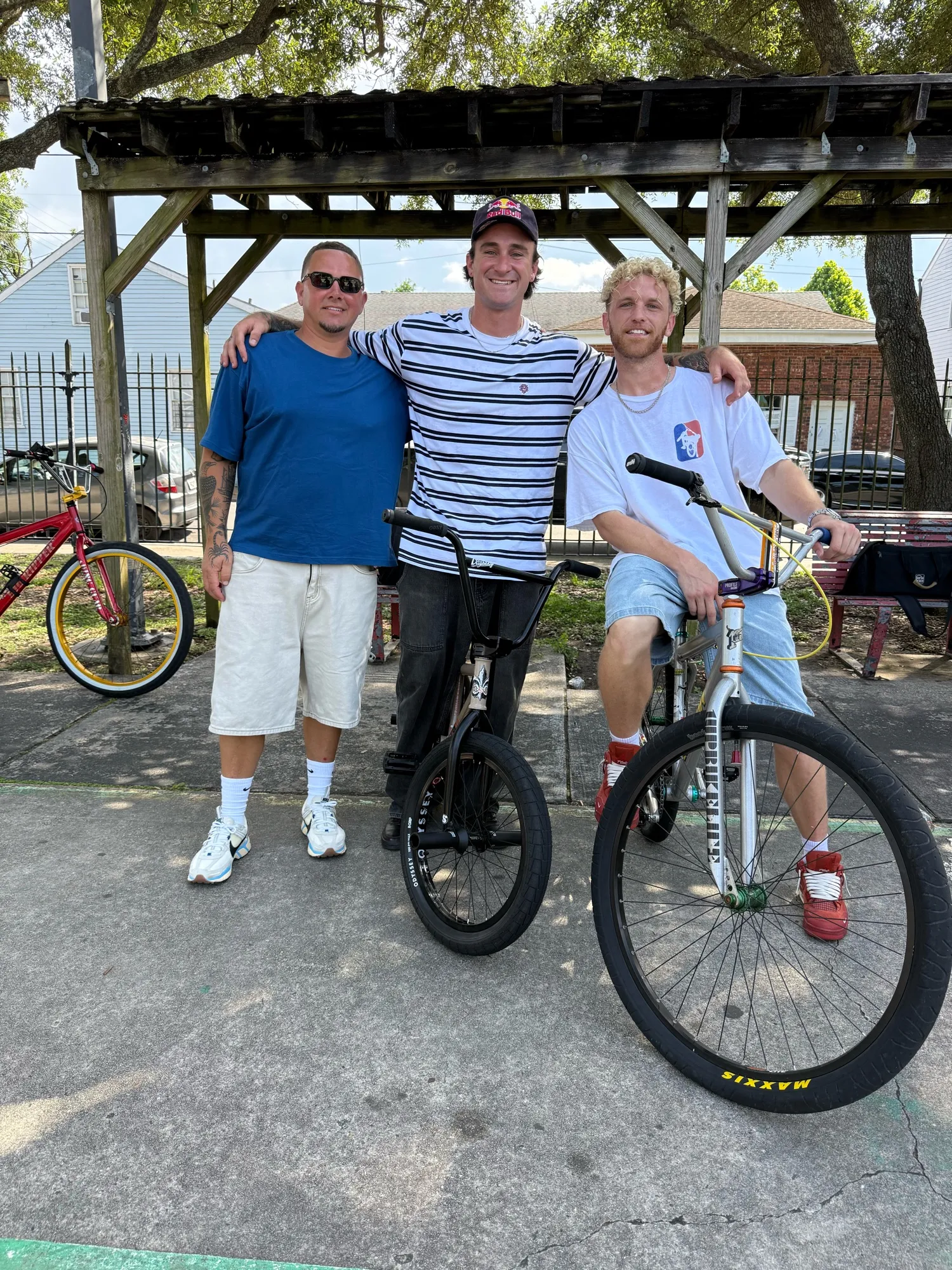 Three riders with 1Up Bike Life bikes under a pavilion in New Orleans
